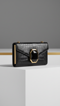 Mini crocodile clutch with obsidian accent